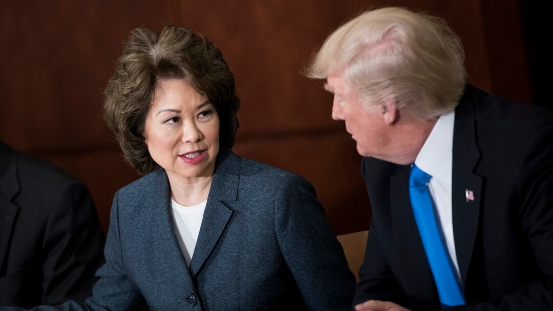 (FILES) In this file photo taken on June 09, 2017, US Transportation Secretary Elaine Chao and US President Donald Trump participate in a roundtable discussion at the US Department of Transportationin Washington, DC.