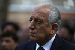 FILE - Washington's peace envoy Zalmay Khalilzad attends the inauguration ceremony for Afghan President Ashraf Ghani at the presidential palace in Kabul, Afghanistan, March 9, 2020.