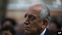 FILE - Washington's peace envoy Zalmay Khalilzad attends the inauguration ceremony for Afghan President Ashraf Ghani at the presidential palace in Kabul, Afghanistan, March 9, 2020. 