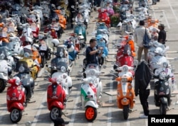 FILE - Vespa scooters are parked outside Bangkok city hall to celebrate Vespa's 65th anniversary in Thailand, in Bangkok.