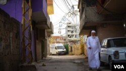 FILE - Nahr al-Bared, in northern Lebanon about 16 kilometers from Tripoli, is home to about 30,000 displaced Palestinians and their descendants. This photo from 2016 shows the camp's small amusement park in the background. (J. Owens/VOA)