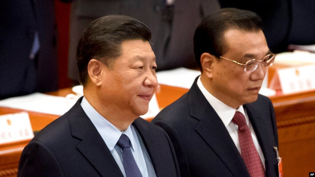 資料照：中國國家主席習近平與總理李克強在北京人大會堂出席全國人大會議閉幕式。 （2019年3月15日）
