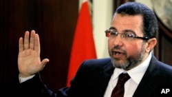 Egyptian Prime Minister Hesham Kandil talks during a press conference at his office in Cairo, Egypt, December. 30, 2012. 