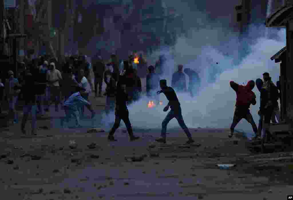 Kashmiri protesters throw stones on government forces during a protest in Srinagar, Indian-controlled Kashmir.