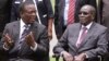 FILE: Emmerson Mnangagwa and then Zimbabwean President Robert Mugabe after the swearing in ceremony at State House in Harare, Friday, Dec, 12, 2014. (AP Photo/Tsvangirayi Mukwazhi)