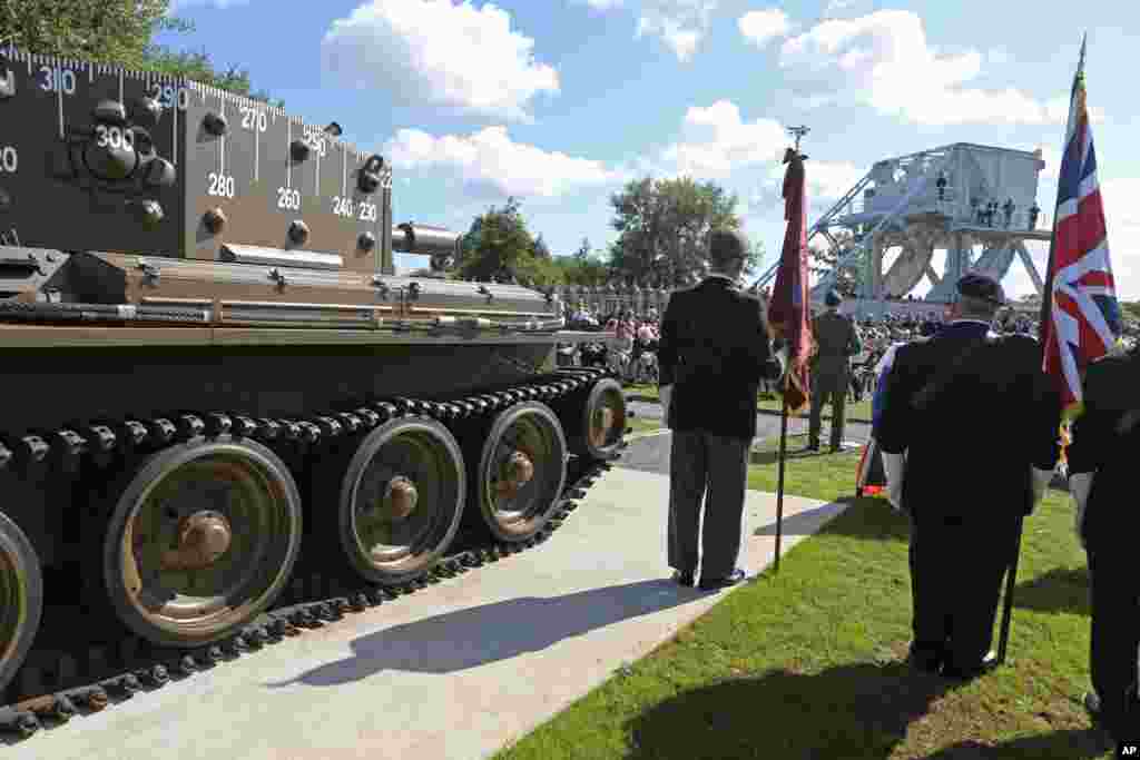 A remembrance ceremony is held at Pegasus Bridge memorial in Benouville, France, as part of the commemoration of the 70th anniversary of D-Day, June 5, 2014.