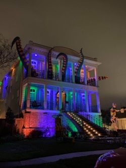 Octopus tentacles burst through the windows of this New Orleans home. (Photo courtesy of Kristin Boring)