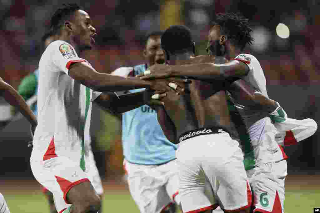 Burkina Faso&#39;s Ismahila Ouedraogo, center, celebrates with teammates after he scored the last penalty kick against Gabon in Cameroon on Jan. 23, 2022.