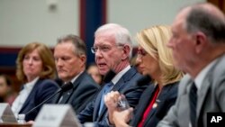 FILE - Captain Chesley "Sully" Sullenberger, along with representatives of several airline associations, speaks during a House Committee on Transportation and Infrastructure hearing on the Boeing 737 MAX status on Capitol Hill, Washington, June 19, 2019.