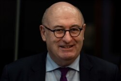 FILE - EU commissioner for Trade Phil Hogan arrives for the inaugural meeting of the college of commissioners, Dec. 4, 2019, at the European commission headquarters in Brussels.