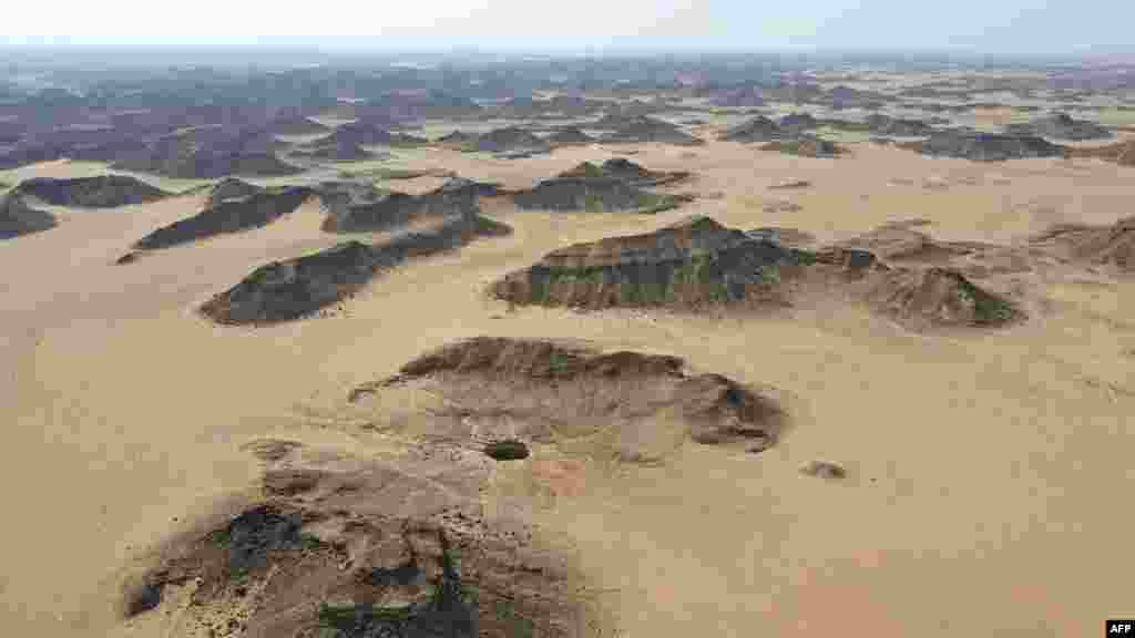 An aerial view shows the Well of Barhout known as the &quot;Well of Hell&quot; in the desert of Yemen&#39;s Al-Mahra province.