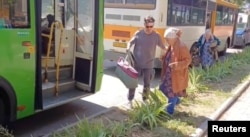 Residents of the Rylsky District board a bus during evacuation following an incursion of Ukrainian troops in the Kursk region, Russia, in this still image taken from video released on Aug. 14, 2024. (Russian Emergencies Ministry via Reuters)