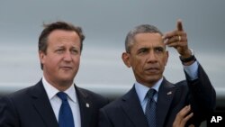 Presiden AS Barack Obama, kanan, bersama Perdana Menteri Inggris David Cameron dalam KTT NATO di Celtic Manor Resort di Newport, Wales, 5 September 2014.