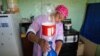 A woman in South Africa purifies drinking water by using a Folia Water paper water filter. Patented in 2016 by US scientist Theresa Dankovich, it works like a high-tech coffee filter and kills most waterborne bacteria and viruses. (Courtesy Folia Water)