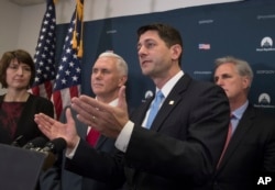 FILE - House Speaker Paul Ryan (foreground) is joined by fellow Republicans, including Vice President-elect Mike Pence (second left), at a news conference at the Capitol in Washington, Jan. 4, 2017..