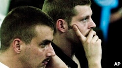 FILE - Norwegian citizens Tjostolv Moland, left, and Joshua French during their trial in Kisangani, Congo, Dec. 3, 2009.