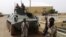 Fighters from the al-Qaida-linked Islamist group MUJAO stand guard in Gao, northern Mali, August 7, 2012. 