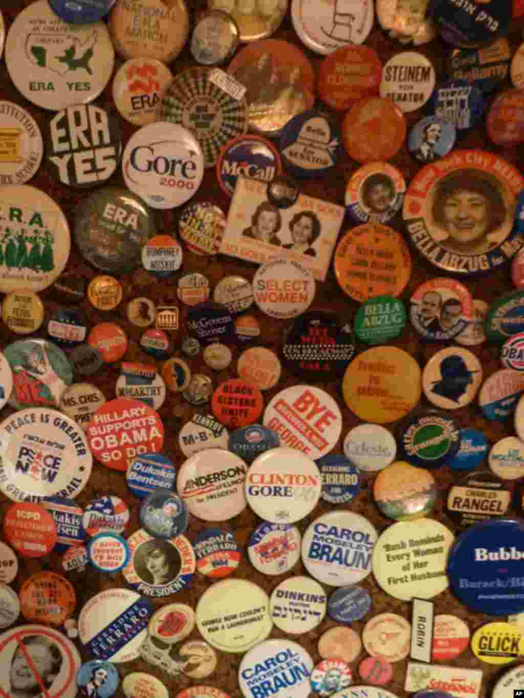 The political pins on Letty Cottin Pogrebin’s kitchen wall in January 2012 are a visual testament to the feminist activism over the decades. (VOA - A. Phillips)