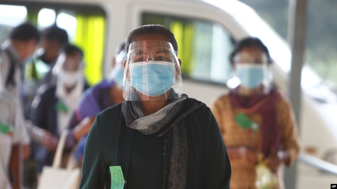 Civic group members arrive at the U.N.-backed war crimes tribunal in Phnom Penh, Cambodia, Aug. 16, 2021.