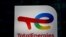 FILE: The logo of French oil and gas company TotalEnergies is pictured at an electric car charging station and petrol station at the financial and business district of La Defense in Courbevoie near Paris, France. Taken 6.22.2021