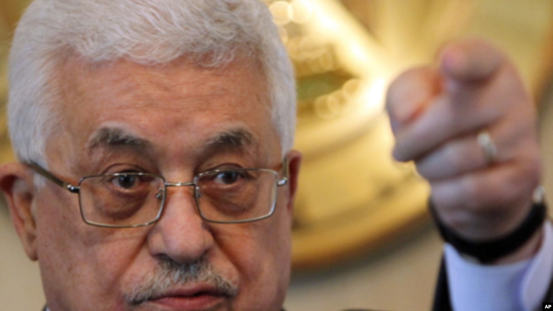 Palestinian President Mahmoud Abbas gestures during a news conference after meeting Egyptian President Hosni Mubarak at the presidential palace in Cairo, 24 Jan 2011