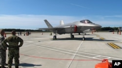  FILE - F-35 fighter jets arrive at the Vermont Air National Guard base in South Burlington, Vt., Sept. 19, 2019. Israel will oppose any U.S. sale of F-35 warplanes to Qatar, Israel's Intelligence Minister Eli Cohen said, Oct. 11, 2020.