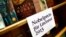 FILE - Books by Canadian writer Alice Munro, the 2013 Nobel Prize in Literature winner, are displayed during the book fair in Frankfurt, Oct. 10, 2013. 
