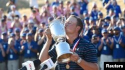 Jordan Spieth kisses the U.S. Open Championshpi Trophy after winning the 2015 U.S. Open golf tournament at Chambers Bay, June 21, 2015. Mandatory Credit: Michael Madrid-USA TODAY Sports.