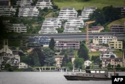A Swiss military boat patrols Lake Lucerne on June 15, 2024, as the Ukraine Peace Summit gets underway at the Burgenstock resort in central Switzerland.