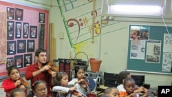 Academy fellow Nathan Schram works with students in New York.