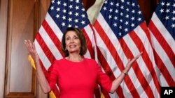 House Speaker Nancy Pelosi of Calif., gestures before a ceremonial swearing-in on Capitol Hill in Washington, during the opening session of the 116th Congress, Jan. 3, 2019.