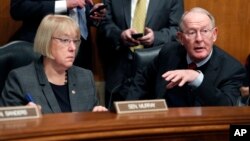 FILE - In this Jan. 31, 2017, photo, Senate Health, Education, Labor, and Pensions Committee Chairman Sen. Lamar Alexander, R-Tenn. and the committee's ranking member Sen. Patty Murray, D-Wash. are seen on Capitol Hill in Washington.