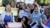 Manifestation contre la violence sexiste devant l'opéra du Caire, le 14 juin 2014, après l'agression sexuelle en publique par un groupe d'hommes sur la place Tahrir. (Reuters) 