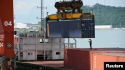 FILE - Shipping containers are seen on a cargo vessel at the Dachan Bay Terminals in Shenzhen, Guangdong province, China, July 12, 2018.