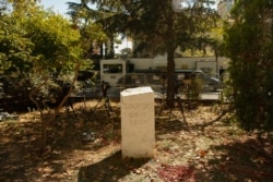 A monument for slain Saudi journalist Jamal Khashoggi is pictured near the Saudi Arabia consulate in Istanbul. The gathering starting at 1:14 p.m. marking the time Khashoggi walked into the building where he met his demise.