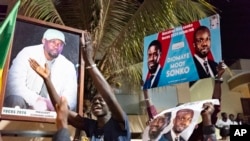 Supporters of Senegalese political leader Ousmane Sonko and his key ally Bassirou Diomaye Faye celebrate the release of the opposition leaders outside Sonko's home in Dakar, Senegal, Thursday, March 14, 2024.