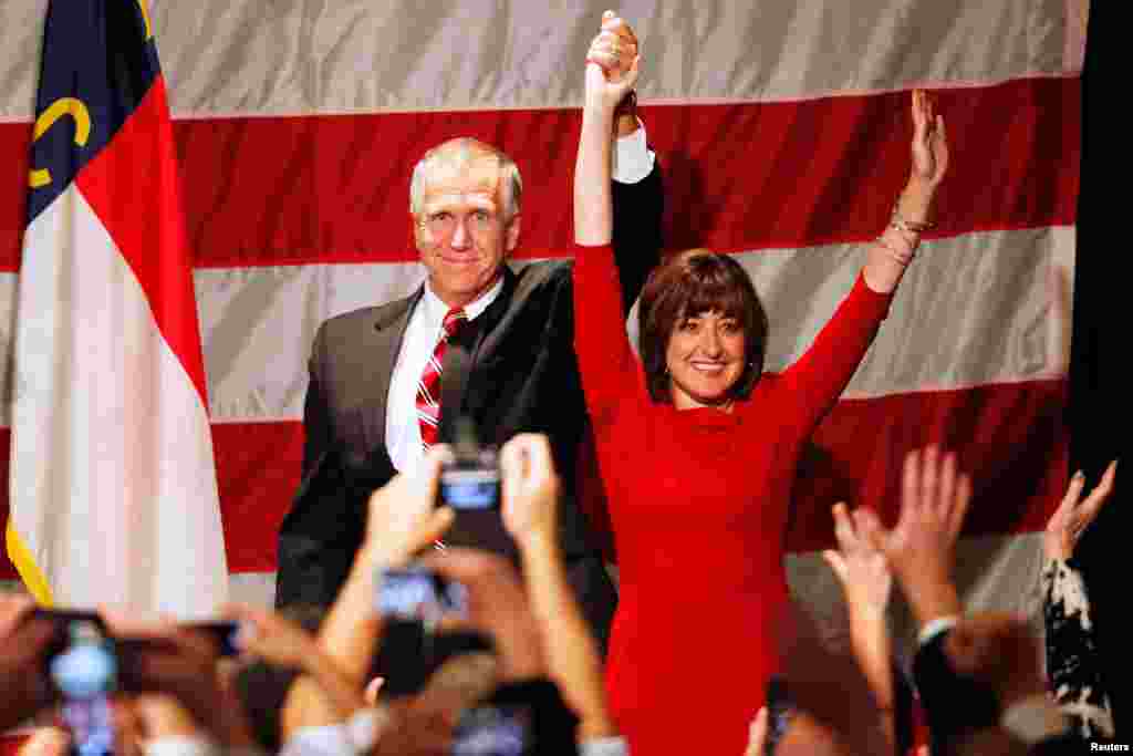 Republican Thom Tillis (L), and wife Susan react after the results of the U.S. midterm elections early morning in Charlotte, North Carolina, Nov. 5, 2014. 