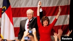 Republican Thom Tillis, left, and wife Susan react after the results of the U.S. midterm elections early morning in Charlotte, North Carolina, Nov. 5, 2014. 