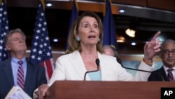 FILE - House Minority Leader Nancy Pelosi, D-Calif., flanked by, Rep. Frank Pallone, D-N.J.,and Rep. Bobby Scott, D-Va., during a news conference on Capitol Hill in Washington, July 20, 2017. 