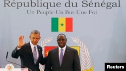 U.S. President Barack Obama participates in a joint news conference with Senegal's President Macky Sall at the Presidential Palace in Dakar, Senegal, June 27, 2013.