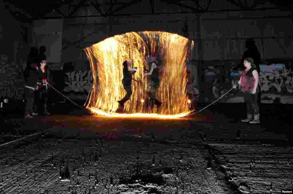 Performers rehearse during a fire show for the opening of a Circus Festival in Dublin, Ireland, April 4, 2016.