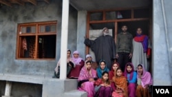 Naeem’s only surviving uncle (top left), Muhammad Shaban Butt, with his wife Fazzi (sitting third from left) and other members of their family at their house in the village of Khaitangan in Indian Kashmir’s Baramulla district.