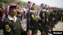 FILE - Jordanian soldiers attend the funeral of Jordanian Captain Rashed Zyoud, who was killed during a raid in Irbid conducted by the Jordanian security forces on Islamic State militants, in Zarqa, Jordan, March 2, 2016.