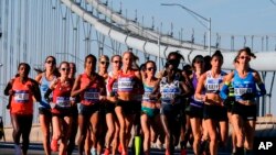 Elite women runners cross the Verrazano-Narrows Bridge during the New York City Marathon on Sunday, Nov. 4, 2018, in New York. (AP Photo/Eduardo Munoz Alvarez)