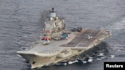 A photo taken from a Norwegian surveillance aircraft shows Russian aircraft carrier Admiral Kuznetsov in international waters off the coast of northern Norway, Oct. 17, 2016.