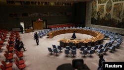FILE — Security walk through the United Nations Security Council chamber, Dec. 21, 2023. On Tuesday, nations expressed support for a future independent Palestinian state, just days after Israel's prime minister took a stand against the two-state solution.