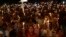 FILE - Pakistani Christians hold candles during a vigil for victims of a deadly suicide bombing on March 27 in Lahore, Pakistan, March 30, 2016. 