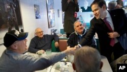 Senator Marco Rubio, a Republican presidential candidate, greets diners at Norton's Classic Cafe while campaigning in Nashua, New Hampshire, Feb. 8, 2016.