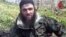 Screenshot from video posted on a pro-rebel Web site purports to show Chechen militant leader Doku Umarov, March 2010 file photo.