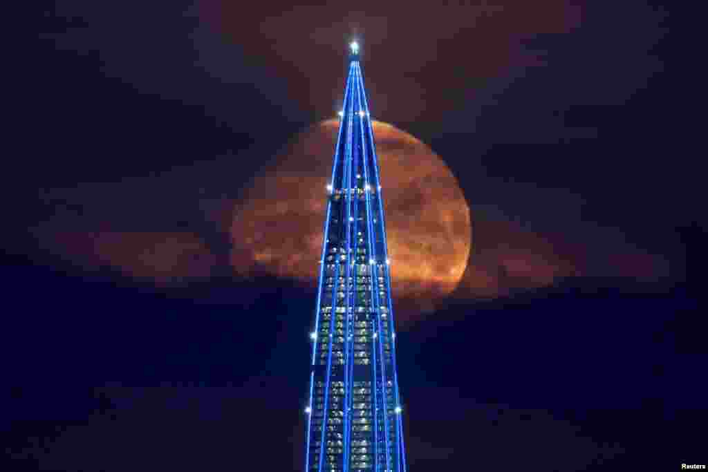 The moon sets behind the business tower Lakhta Centre, which is under construction in Saint Petersburg, Russia.